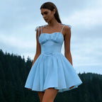Woman wearing the Modarine tie-strap ruched-bodice mini dress