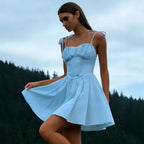 Woman wearing the Modarine tie-strap ruched-bodice mini dress