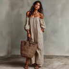 Woman wearing the Modarine striped off-shoulder puff-sleeve maxi dress
