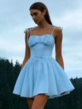 Woman wearing the Modarine tie-strap ruched-bodice mini dress